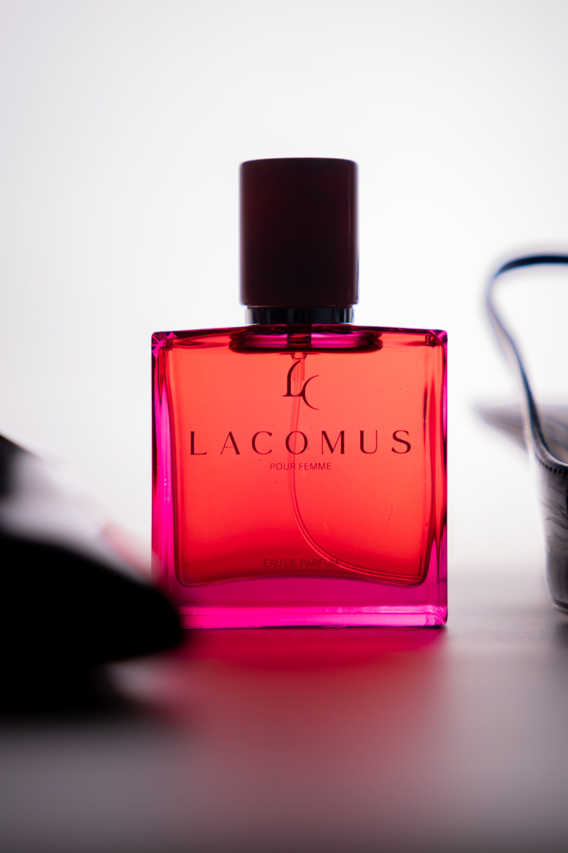 Lacomus fragrance bottle in professional outdoor lifestyle photography portrait