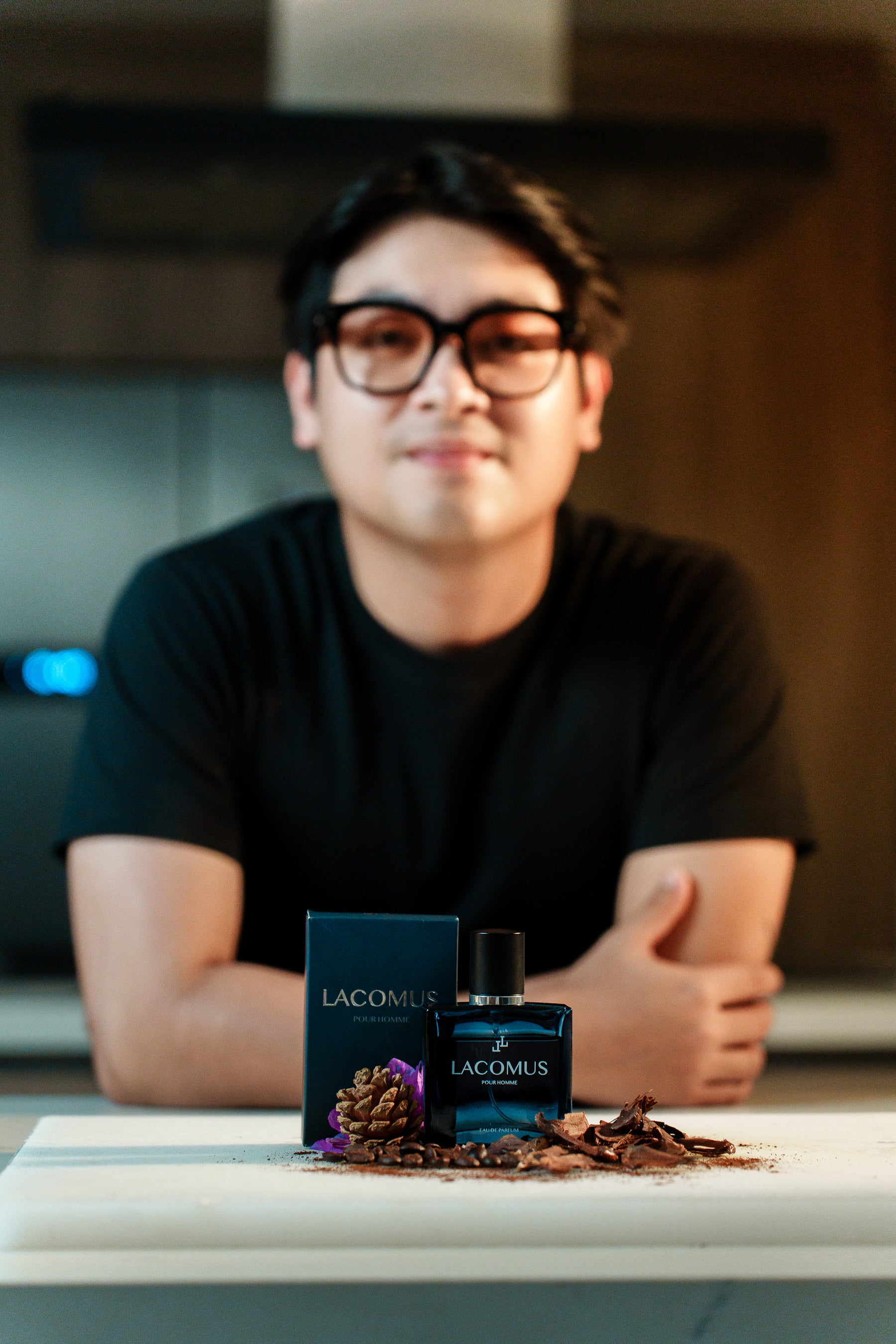 Lacomus signature fragrance bottle in professional portrait product photography session